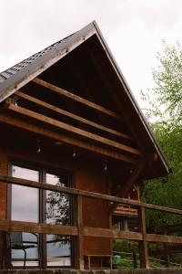 a log cabin with a large window in front at Domek Panorama in Lipowa