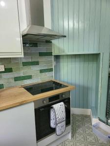 a kitchen with a stove and a dishwasher at 16 Northcote Street, Wick in Wick +15 photos
