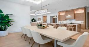 a kitchen and dining room with a table and chairs at Naples Luxury Retreat in Naples
