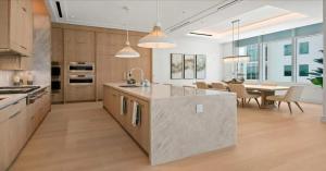 a large kitchen with a table and a dining room at Naples Luxury Retreat in Naples +13 photos