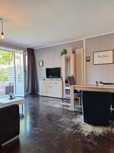 a living room with a table and a couch at Fewo RELAX in Borken