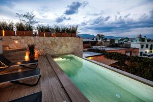 a swimming pool on the roof of a building at 7 Casa Laurel Hotel Boutique in Oaxaca City