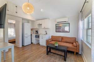 a living room with a couch and a kitchen at Ocean Surf at York Beach in York