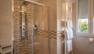 a bathroom with a shower with a glass door at La locanda di Gioele in Lido di Camaiore +42 photos