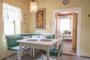a dining room with a table and chairs at Atriumhof in Rust