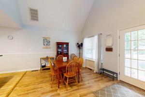 a dining room with a table and chairs at 37 Moonraker Road in Ocean Pines