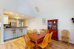 a kitchen and dining room with a table and chairs at 37 Moonraker Road in Ocean Pines