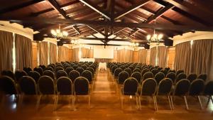 an empty room with chairs and a screen at Turismo Hotel Casino in Corrientes +59 photos