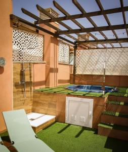 a large room with a shower and a pool at Vera dream Las Marinas LAGUNA BEACH in Vera