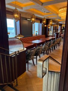 a row of tables and chairs in a restaurant at Bayview Lodge in Downings
