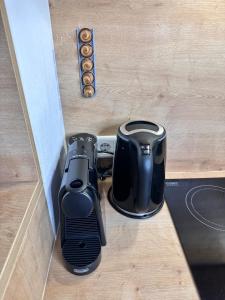 a toaster sitting on a counter next to a coffee maker at Grimming Lodge Tauplitz II in Tauplitz