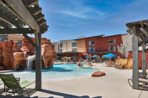 a pool at a hotel with a water park at Fairfield by Marriott Inn & Suites Moab in Moab