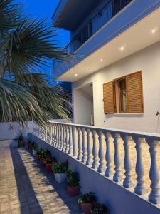 a balcony of a house with plants at Versailles Rooms in Dukati i Ri