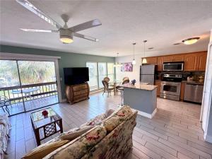 a living room with a couch and a kitchen at 1+1 Large condo Sarasota in Sarasota