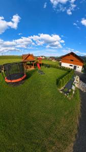 an aerial view of a yard with a playground at Apartmány Dominek in Ždiar