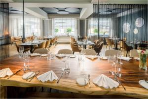 a dining room with a large table and chairs at Landgasthof Eiserner Ritter in Boppard