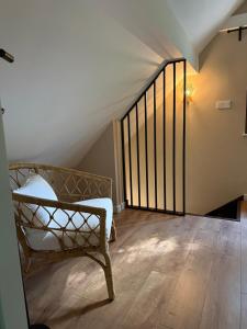 a staircase with a bench in a room at Magiczne Roztocze in Koszele