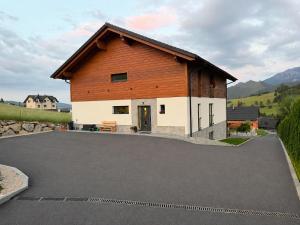 a barn with a parking lot in front of it at Apartmány Dominek in Ždiar +37 photos