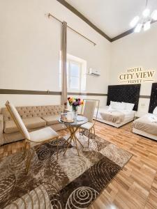 a living room with a couch and a table at Velvet city view in Cairo