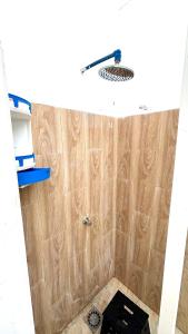 a bathroom with a shower with a toilet in it at Surf house apartment in Oualidia +25 photos