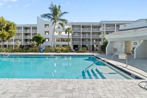 a swimming pool in front of a apartment building at Island Beach Club P4E in Sanibel