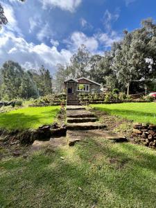 a house with stairs leading up to a yard at Springdale Villa in Kodaikānāl +20 photos