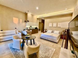 a large living room with a bed and a couch at Seabreeze Baku White Residence Studio, Terrace in Baku