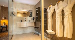 a bathroom with a shower and a sink at Hotel Restaurant L'Orchidee in Ensisheim +34 photos