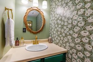 a bathroom with a sink and a mirror at Harvest and Hearth in Galena +14 photos