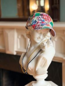 a statue of a woman wearing a hat and necklace at Brickhaven Inn & Hotel in South Bend +6 photos
