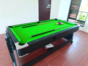 a pool table sitting on top of a floor at Michaels Spring Resort, Natural Hot Spring in Calamba
