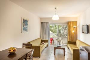 a living room with a couch and a table at Euronapa Hotel in Ayia Napa