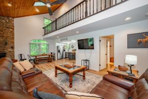 a living room with a couch and a table at Peace at Last by Railey Vacations in McHenry