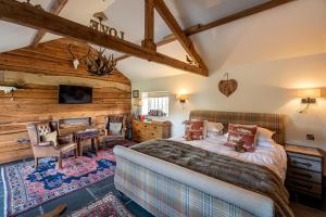 a bedroom with a bed and a couch in a room at 8lacksmith's Shop in York