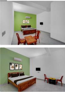 a bedroom with two beds and a table and chairs at hotel 0771 in Raipur