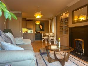 a living room with a couch and a table at Mountain Way in Dublin