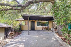 a small yellow house with a large tree overhead at Quiet Patio! La Cañada Month-Long Studio in La Canada Flintridge