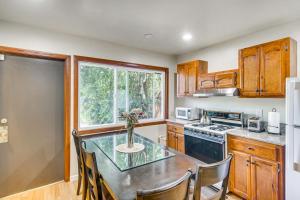 a kitchen with a table with chairs and a window at Quiet Patio! La Cañada Month-Long Studio in La Canada Flintridge +17 photos
