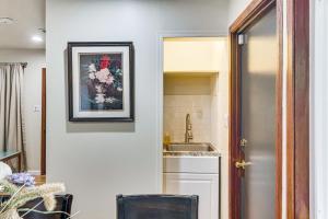 a kitchen with a sink and a picture on the wall at Quiet Patio! La Cañada Month-Long Studio in La Canada Flintridge