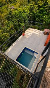 a swimming pool on top of a patio at Vega Glamping in La Vega