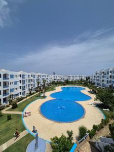 an aerial view of a swimming pool at a resort at Jawhara smir 2ET vue piscine in M'diq