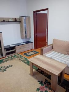 a living room with a couch and a table at Smestaj Prokuplje in Prokuplje