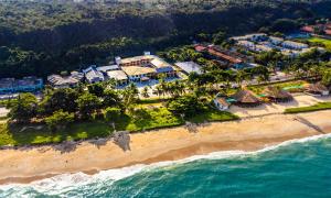 an aerial view of a resort on the beach at Porto Cálem Praia Hotel in Porto Seguro +59 photos