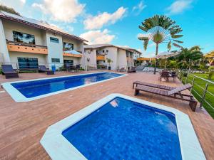 an image of a swimming pool at a house at Porto Cálem Praia Hotel in Porto Seguro