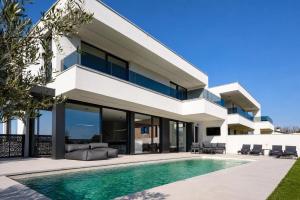 an image of a house with a swimming pool at Villa9eleven in Novigrad Istria
