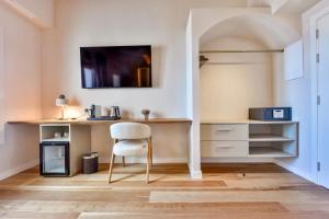 a bedroom with a desk and a chair in a room at Las Torres by Santas Hotels in Altea +29 photos