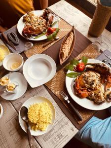 a table with plates of food on top at Boraha Village Ecolodge in Ambodifototra