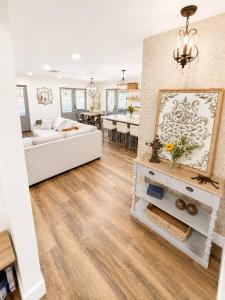 a living room with a white couch and a table at Wranglers Rest Ranch in Arroyo Grande +32 photos