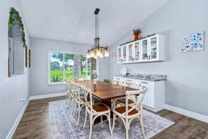 a dining room with a wooden table and chairs at Paradise On Park in Seminole +74 photos