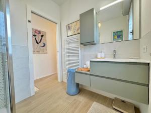 a bathroom with a sink and a counter top at Casa Lido in Lido Adriano +34 photos
